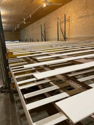 Drying racks filled with freshly primed components